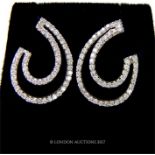 A pair of white gold and diamond earrings
