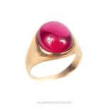 A 9 ct yellow gold and red cabochon stone ring