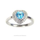 A 9ct white gold heart shaped diamond and aquamarine ring