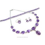 A sterling silver and claw- set purple glass (paste) suite of jewellery