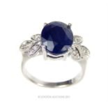 A sapphire, CZ and silver ring