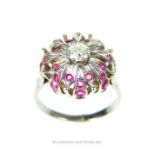 A white gold pink sapphire and diamond ring