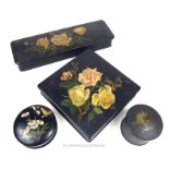 A set of Victorian, black- lacquered, hand-painted papier mache boxes