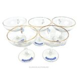 Five retro Babycham drinking glasses.