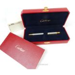 A fine, boxed, Cartier, gold plated ballpoint pen