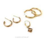 A pair of 9 ct hoop earrings with three bands of different coloured gold (rose, yellow and white)