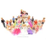 A collection of over 35 Barbie/Sindy dolls; with costumes but all unboxed.