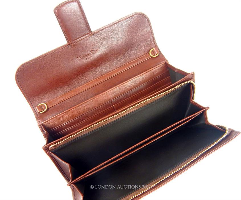 A Ladies Christian Dior purse; in brown leather with gold metal fitting - Image 2 of 2