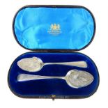 A cased pair of Victorian sterling silver ice cream spoons