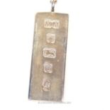 A sterling silver ingot pendant and chain