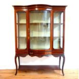 An Edwardian mahogany vitrine with bow fronted glass door; fine quality inlays; 136cm wide; 178cm