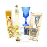 A collection of four vintage Avon pressed glass items in their original boxes