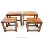 Two sets of stained Indian hardwood side tables with metal fittings