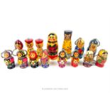 A collection of Russian Matryoshka dolls, mainly in the form of key rings