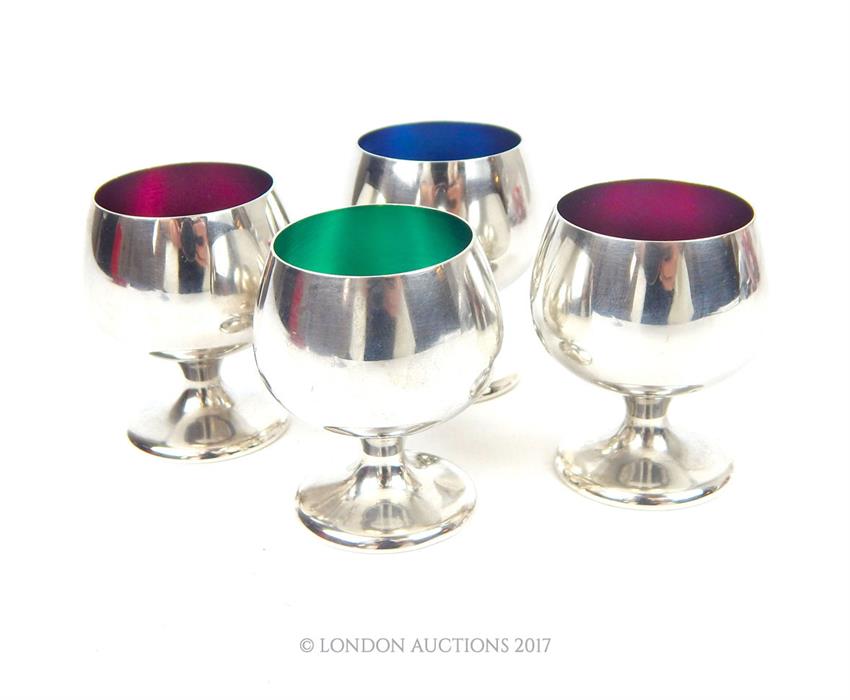 A set of four American silver and enamel liqueur cups