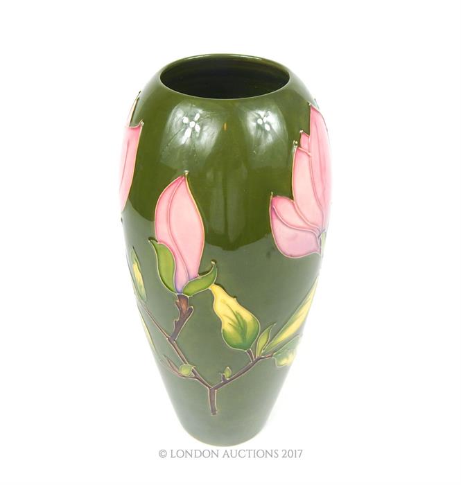 A large Moorcroft pottery vase with green ground - Image 2 of 3