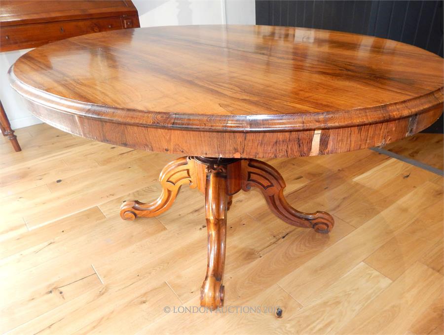 A fine quality Georgian rosewood tilt top table raised upon a quadraform base; top 145 cm oval. - Image 2 of 2