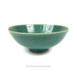 A Chinese porcelain bowl with a mottled turquoise glaze