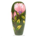 A large Moorcroft pottery vase with green ground