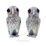 A pair of continental 800 marked silver owl form condiments.