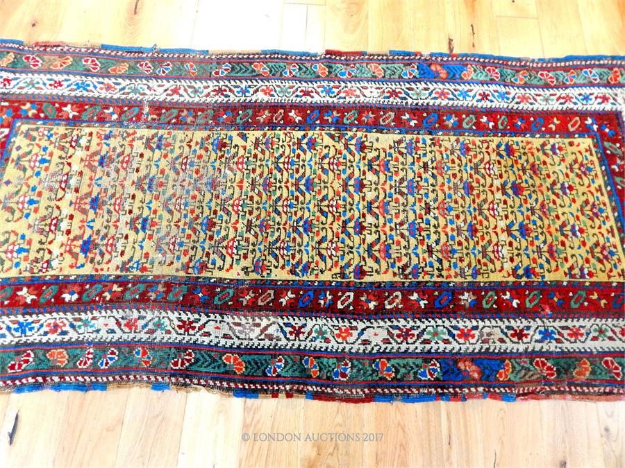 A hand made Persian runner with repeating motifs of a yellow field - Image 2 of 3