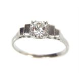 An Art Deco style, 18ct diamond ring of 50 points; size M/N.