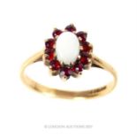 A 9ct gold, opal and garnet cluster ring, size K, 1.6g