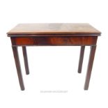 A George III mahogany tea table, the rectangular top above a gate leg action and moulded square