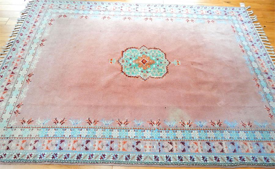 A Moroccan carpet, the green medallion on a pink field - Image 2 of 3