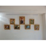A set of seven, decorative, colour prints in gilded frames