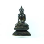 An Indian carved hardwood figure of a seated Buddha; 45cm high.