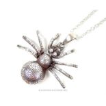 A silver spider pendant (3cm long) on a silver chain; both stamped "925"