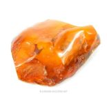 A large chunk of natural Baltic amber, containing some flakes of gold, 130g.