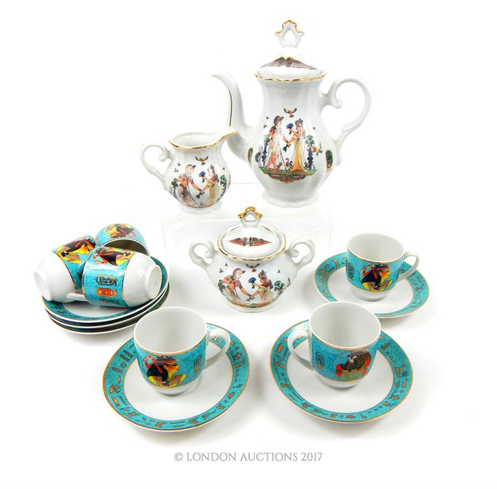 An Egyptian 'Fine Royal Porcelain' coffee service together with a set of six coffee cups and saucers