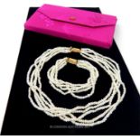 A fine, cased, seed pearl rope twist necklace and bracelet set