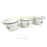 A set of three Chinese blue and white bowls decorated with Chinese characters