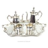 A silver plated four piece tea and coffee set, together with a silver plated twin handled tray