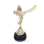 A reproduction white metal Rolls Royce style mascot on faux marble base; 31.5cm high.