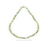 A Chinese green jade beaded necklace with 9 ct yellow gold clasp
