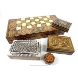 A collection of Eastern, inlaid boxes to include a backgammon board and counters