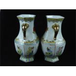 A pair of large Chinese porcelain vases with twin gilt elephant head handles