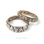 Two 9ct gold and silver rings, both decorated with repeating geometric patterns, 4.5g gross
