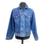 A 1960's Levi Strauss & Co denim jacket, the Levis label bearing a capital E.