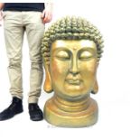 A large gilt Buddha head, 82 x 50 x 50cm.