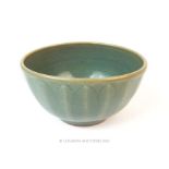 A Chinese celadon bowl with slightly lobed sides