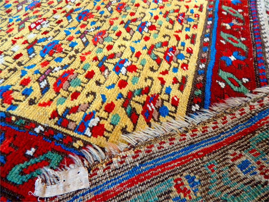 A hand made Persian runner with repeating motifs of a yellow field - Image 3 of 3