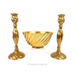 A pair of Indian brass candlesticks, together with a matching bowl