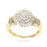 A 9 ct yellow gold and diamond cluster ring