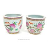 A pair of Chinese porcelain jardinieres, hand painted in the famille rose palette with bats