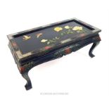 A 20th century Chinese black lacquered, painted and gilded low table, the top inlaid with mother of